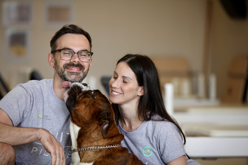 Elisa and Jarryd, owners of Unity Pilates in East Brighton pictured with their dog.