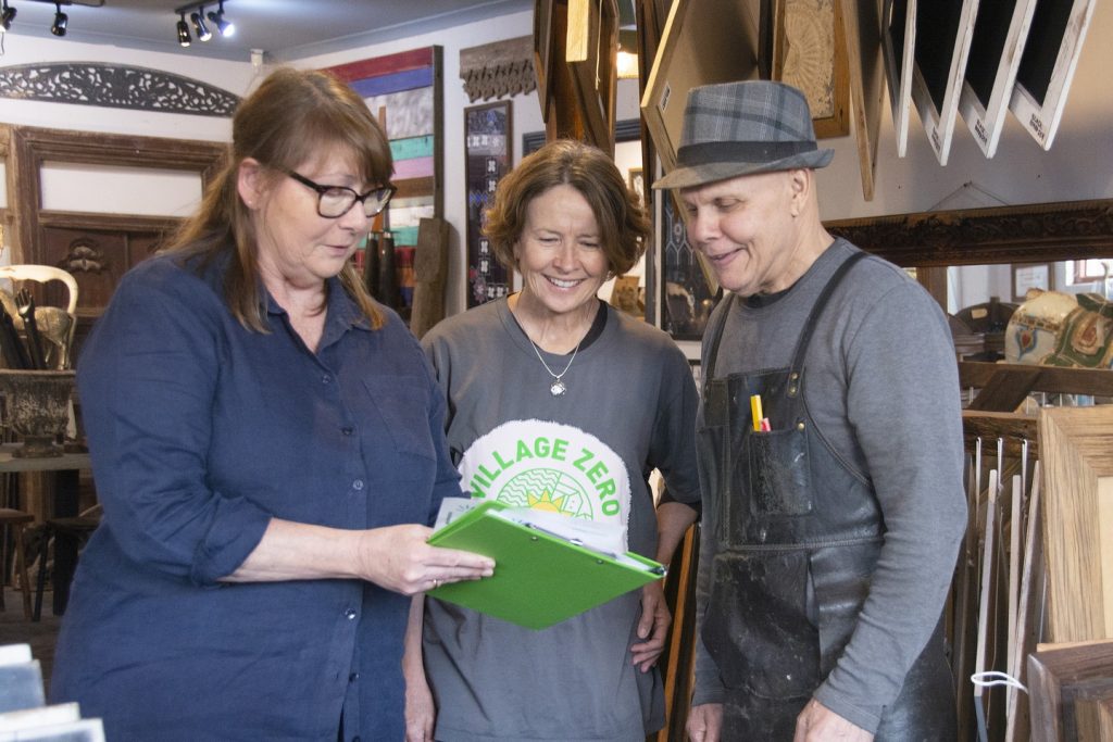 Danielle King of Green Moves, speaking with Gerard Melder - owner of Mulbury, and Helen Gibson from Village Zero during an energy assessment.