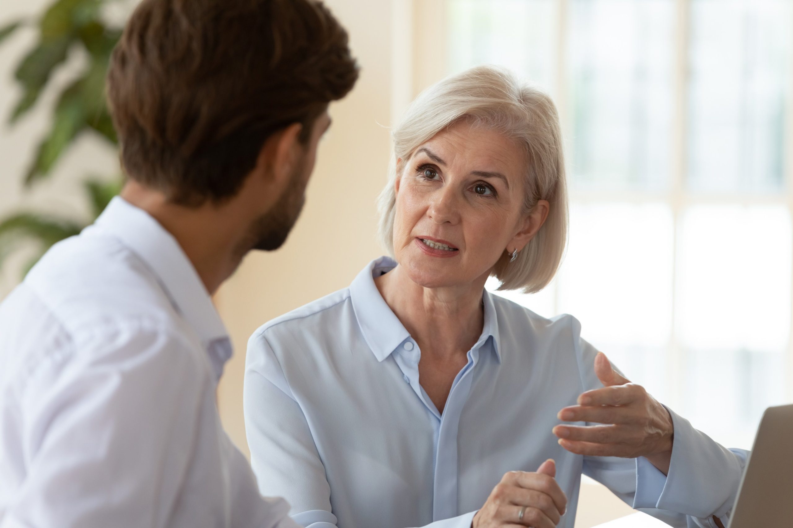 A sustainability consultant onsite with a business client providing advice
