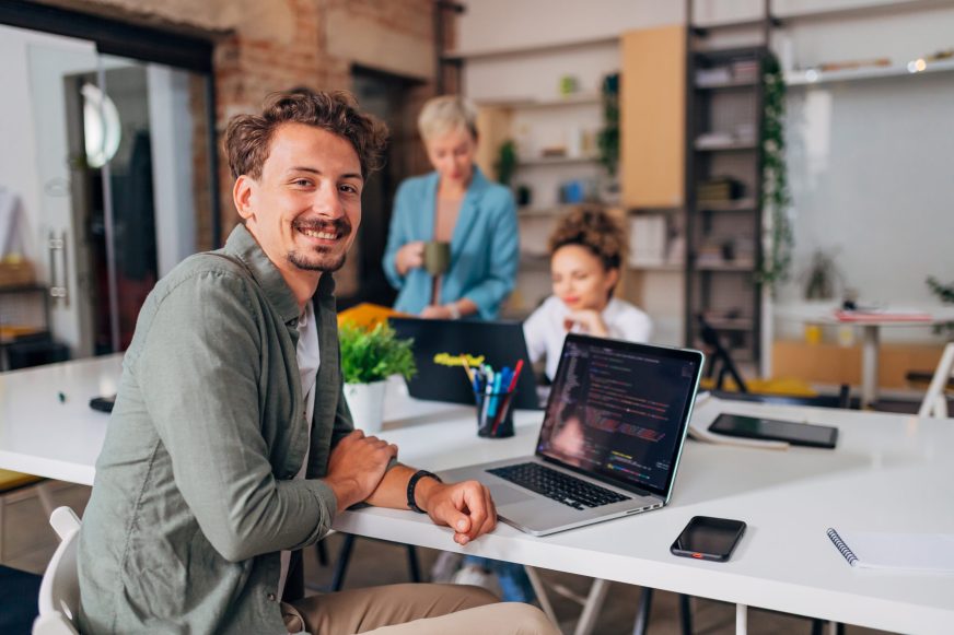 Man with laptop working in a shared space