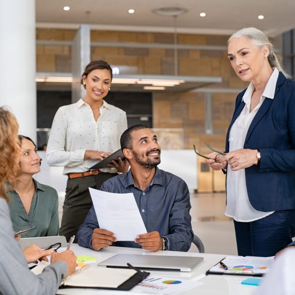 Woman advising a team at work