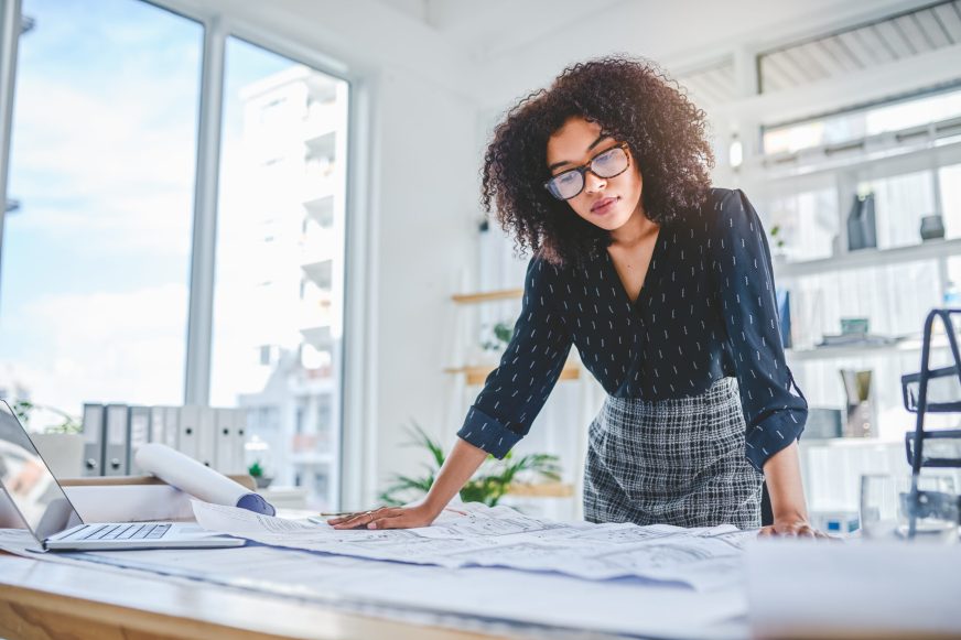 Woman reviewing building plans